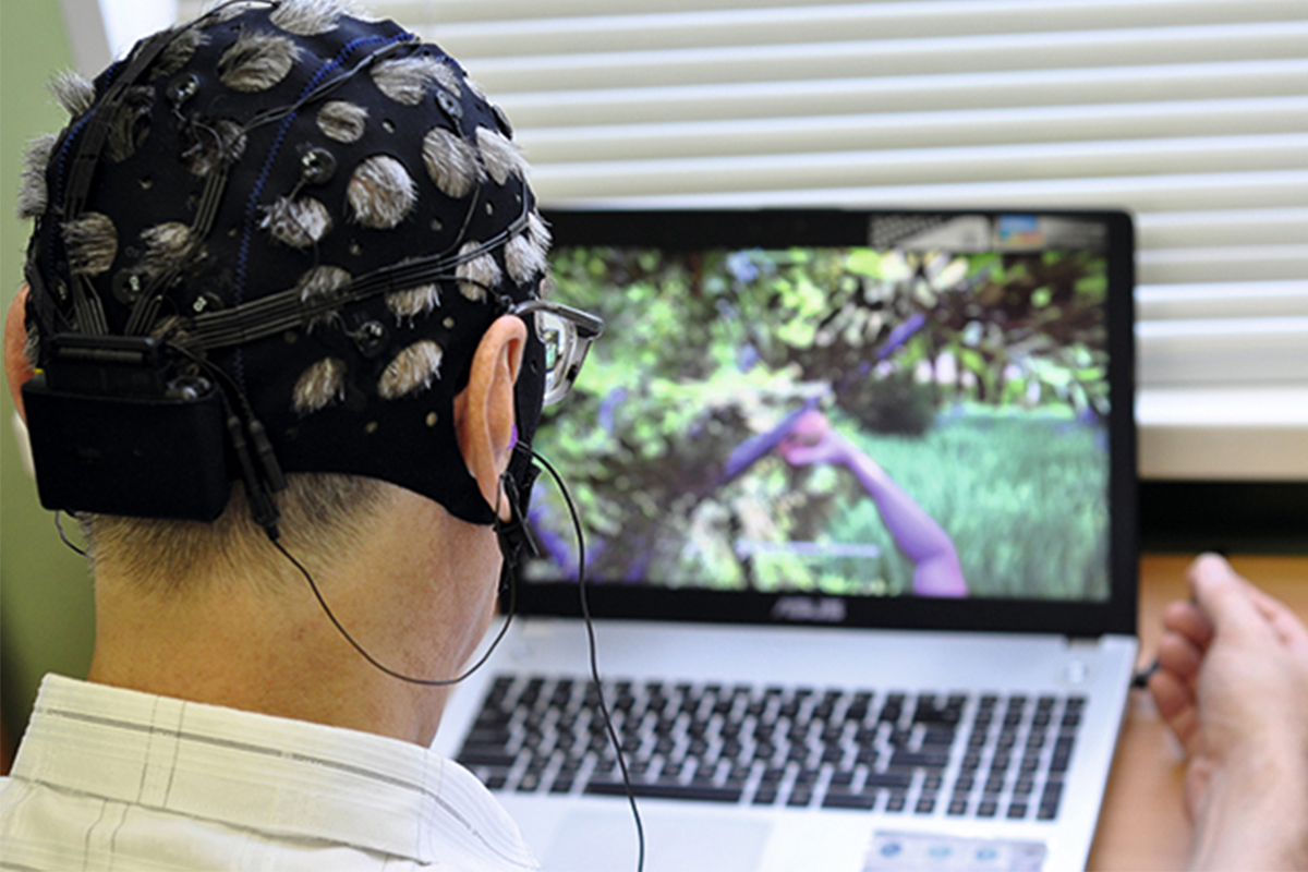 An electroencephalograph and a specialized game in the laptop